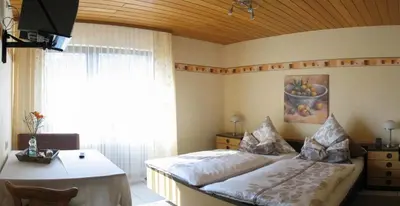 Ein Bett oder Betten in einem Zimmer der Unterkunft Pension Hilberath