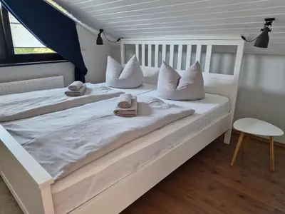 Ein Bett oder Betten in einem Zimmer der Unterkunft FeWo-KaRitz