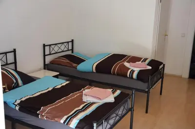Ein Bett oder Betten in einem Zimmer der Unterkunft Bergmühle Simmertal