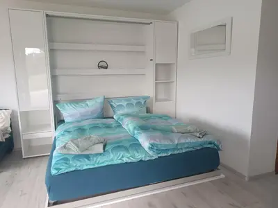Ein Bett oder Betten in einem Zimmer der Unterkunft Apartment mit Rheinblick