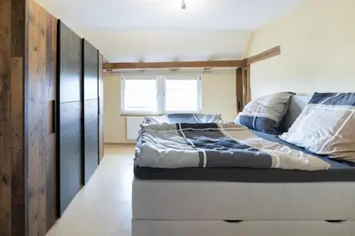 Ein Bett oder Betten in einem Zimmer der Unterkunft Ferienhaus Zur alten Linde
