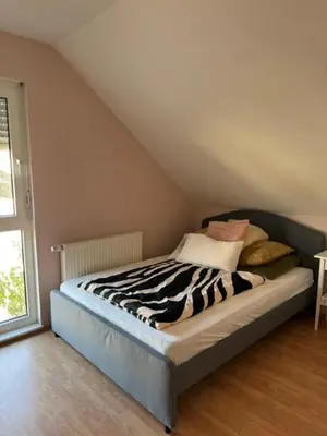 Ein Bett oder Betten in einem Zimmer der Unterkunft Familien Ferienhaus im Grünen in direkter Nähe zum Nürburgring