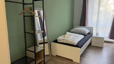 Ein Bett oder Betten in einem Zimmer der Unterkunft Koblenz Executive Suites