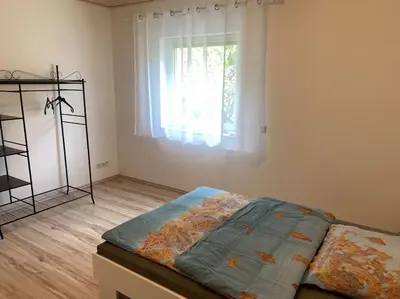 Ein Bett oder Betten in einem Zimmer der Unterkunft Ferienwohnung Bangert