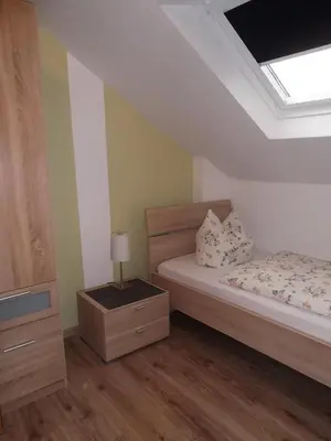 Ein Bett oder Betten in einem Zimmer der Unterkunft Ferienwohnung Schmitz