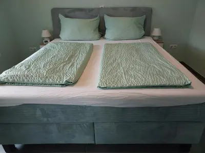 Ein Bett oder Betten in einem Zimmer der Unterkunft Ferienwohnung Sarah & Thorsten Blum