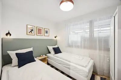Ein Bett oder Betten in einem Zimmer der Unterkunft Helle & moderne Wohnung mit Panorama-Balkon