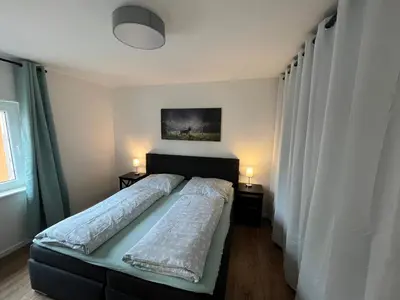 Ein Bett oder Betten in einem Zimmer der Unterkunft Al Backstuff