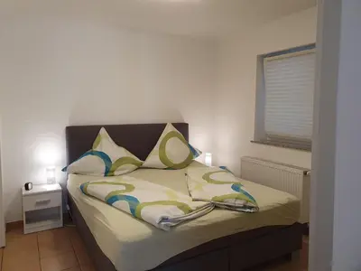 Ein Bett oder Betten in einem Zimmer der Unterkunft Ferienwohnung Ela 1