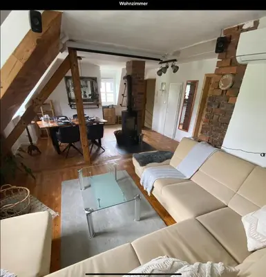 Ein Sitzbereich in der Unterkunft gemütliche rustikale Wohnung mit Kamin und optionalem Whirlpool
