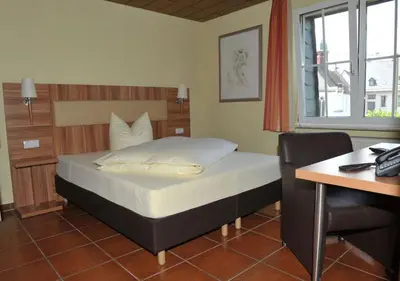 Ein Bett oder Betten in einem Zimmer der Unterkunft Hotel Grüters
