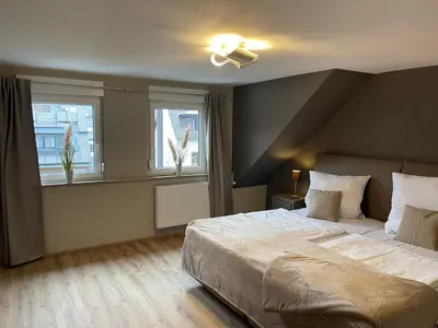Ein Bett oder Betten in einem Zimmer der Unterkunft Ferienhaus Mosel-Wohnen l