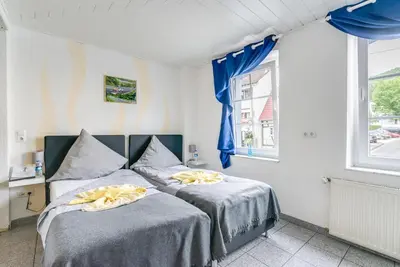 Ein Bett oder Betten in einem Zimmer der Unterkunft Nurburgring Rooms Pinocchio