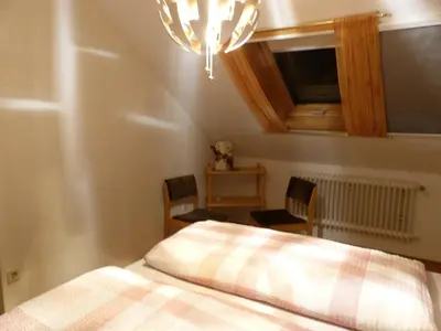 Ein Bett oder Betten in einem Zimmer der Unterkunft Ferienwohnung Domblick