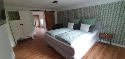 Ein Bett oder Betten in einem Zimmer der Unterkunft Cottage MaarBurg