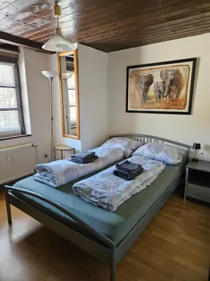 Ein Bett oder Betten in einem Zimmer der Unterkunft Das Alte Kneipchen