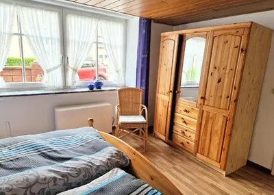 Ein Bett oder Betten in einem Zimmer der Unterkunft Ferienwohnung Zur Kasselburg