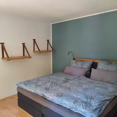 Ein Bett oder Betten in einem Zimmer der Unterkunft Ferienhaus am Schloß