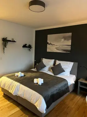 Ein Bett oder Betten in einem Zimmer der Unterkunft Rheinpanorama Suite mit Balkon