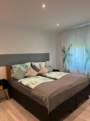 Ein Bett oder Betten in einem Zimmer der Unterkunft Ferienwohnung Mobembo