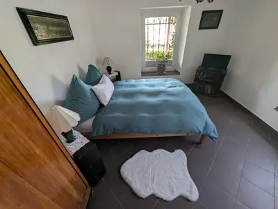 Ein Bett oder Betten in einem Zimmer der Unterkunft Ferienwohnung der besonderen Art in Villa am Glan