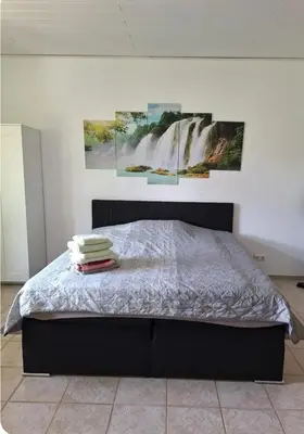 Ein Bett oder Betten in einem Zimmer der Unterkunft Apartment direkt an der Lahn