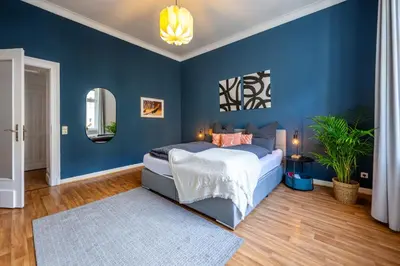 Ein Bett oder Betten in einem Zimmer der Unterkunft Südstadt Oase auf zwei Etagen 4 SZ und Balkon