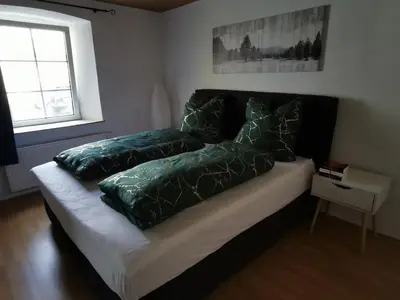 Ein Bett oder Betten in einem Zimmer der Unterkunft Idyllische Ferienwohnung nahe Nürburgring