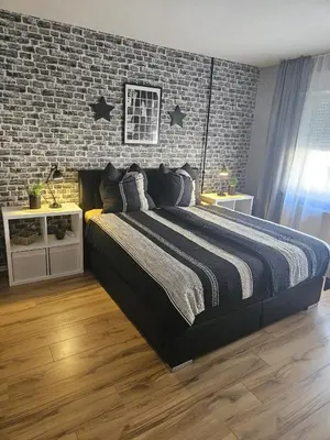 Ein Bett oder Betten in einem Zimmer der Unterkunft Hakans moselblick Ferienwohnung 2