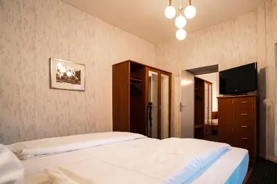 Ein Bett oder Betten in einem Zimmer der Unterkunft Trip Inn Parkhotel Bad Ems