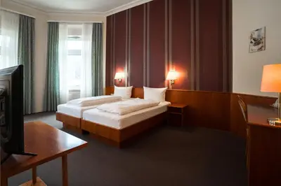 Ein Bett oder Betten in einem Zimmer der Unterkunft Trip Inn Parkhotel Bad Ems