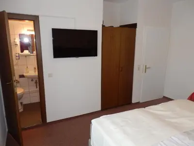 Ein Bett oder Betten in einem Zimmer der Unterkunft Hotel Rheinischer Hof