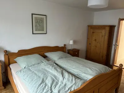 Ein Bett oder Betten in einem Zimmer der Unterkunft Ferienwohnung Baumann