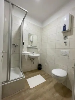 Ein Badezimmer in der Unterkunft City Apartments Trier Suite 4