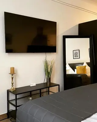 Ein Bett oder Betten in einem Zimmer der Unterkunft City Apartments Trier Suite 5