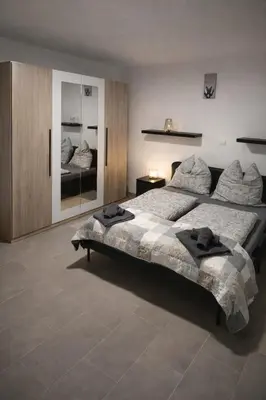 Ein Bett oder Betten in einem Zimmer der Unterkunft Giovanna Ferienwohnung