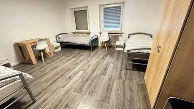 Ein Bett oder Betten in einem Zimmer der Unterkunft KomfortKoblenz WE17