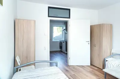 Ein Bett oder Betten in einem Zimmer der Unterkunft StadtRaum mit 3 Zimmer am Rhein WE5