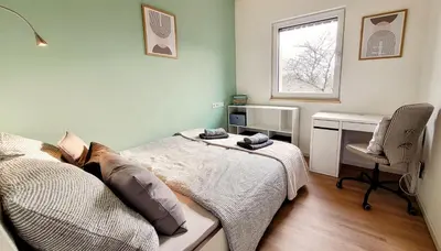 Ein Bett oder Betten in einem Zimmer der Unterkunft Ferienwohnung Traumpanorama im HerberHaus Hunsrück