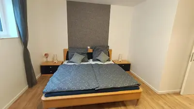 Ein Bett oder Betten in einem Zimmer der Unterkunft Ferienwohnung Zum Kreuzbaum