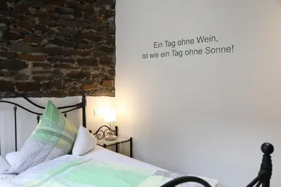 Ein Bett oder Betten in einem Zimmer der Unterkunft Gästehaus Knaup