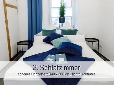 Ein Bett oder Betten in einem Zimmer der Unterkunft Ferienwohnung Alte Schule Kennfus - Ruhe genießen