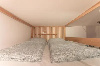 Ein Bett oder Betten in einem Zimmer der Unterkunft Sam and Karo City Studio