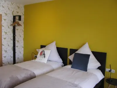 Ein Bett oder Betten in einem Zimmer der Unterkunft Kräuterhotel Villa Vontenie