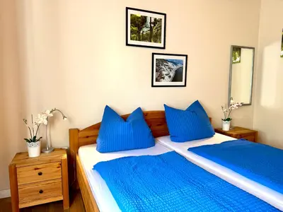 Ein Bett oder Betten in einem Zimmer der Unterkunft Burggarten Wine Residences - Wein direkt vom Winzer, eBike & eAuto aufladen und parken