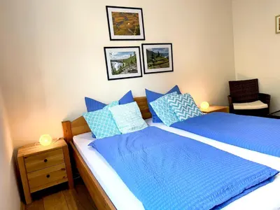 Ein Bett oder Betten in einem Zimmer der Unterkunft Burggarten Wine Residences - Wein direkt vom Winzer, eBike & eAuto aufladen und parken