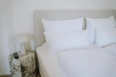 Ein Bett oder Betten in einem Zimmer der Unterkunft KAROLINGERHOF - Mosel