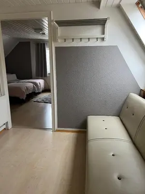 Ein Bett oder Betten in einem Zimmer der Unterkunft Geräumige Ferienwohnung in direkter Nähe zum Rhein