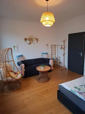 Ein Bett oder Betten in einem Zimmer der Unterkunft Ferienzimmer by Riela im ehemaligem Hotel Schöneck