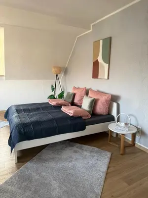 Ein Bett oder Betten in einem Zimmer der Unterkunft Schickes Apartment am Rhein